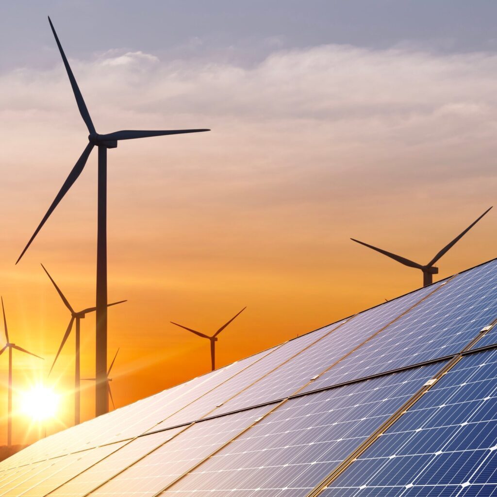 Wind,Turbine,With,Solar,Panels,And,Sunset.,Concept,Clean,Energy.